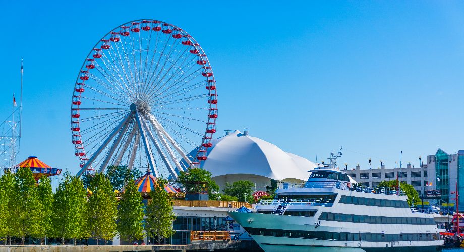 Yacht and Ferris Wheel on a clear day on Navy Pier, Chicago