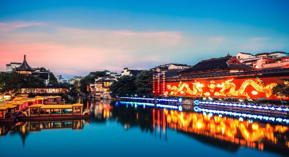 Nanjing’s Fuzimiao Confucius Temple lit up at night on the river