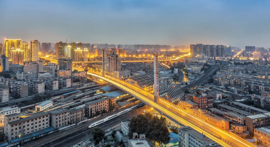 Cityscape of Zhengzhou at dusk with traffic light streaks 