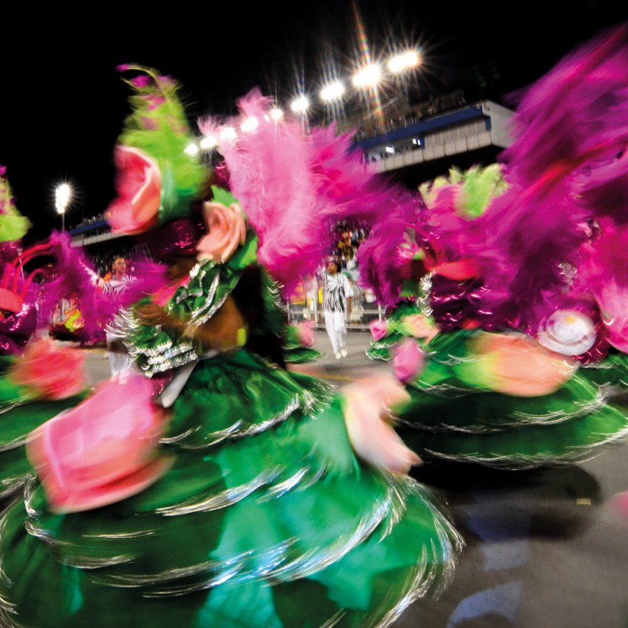 Dancers spinning in colourful green dresses 