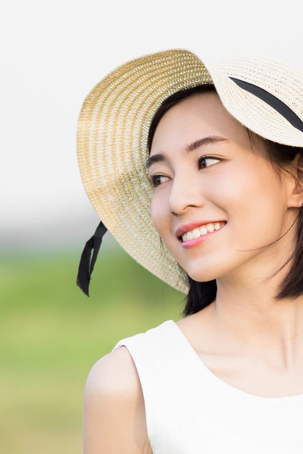 Woman wearing hat outside 