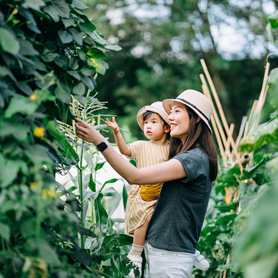 Mum and baby looking at trees. Credit: Getty Images