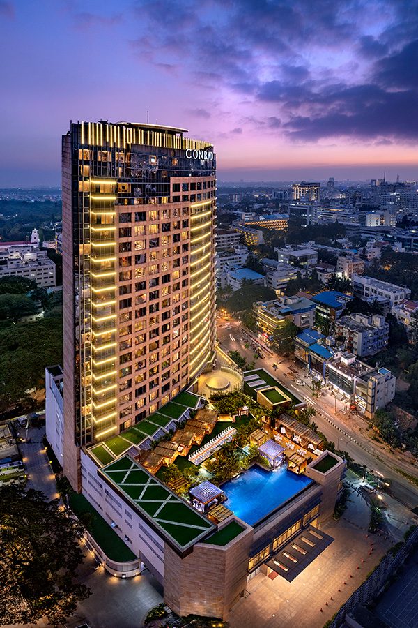 Exterior of Conrad Bengaluru at nighttime. Courtesy image