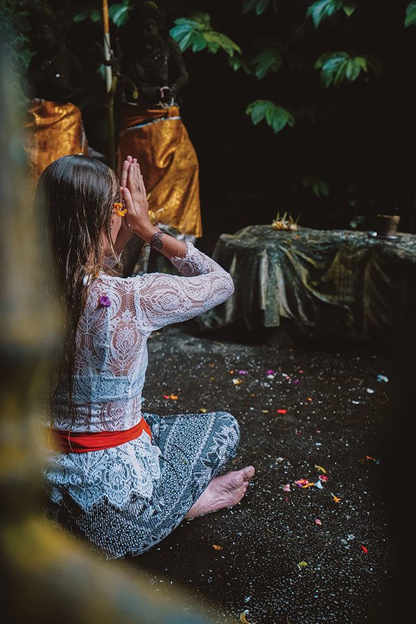 A woman sitting down outdoors