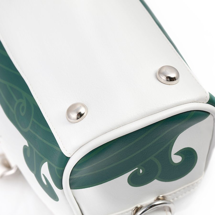 Close up of the premium silver hardware at the bottom of the Cathay Classic bowling bag in cream white