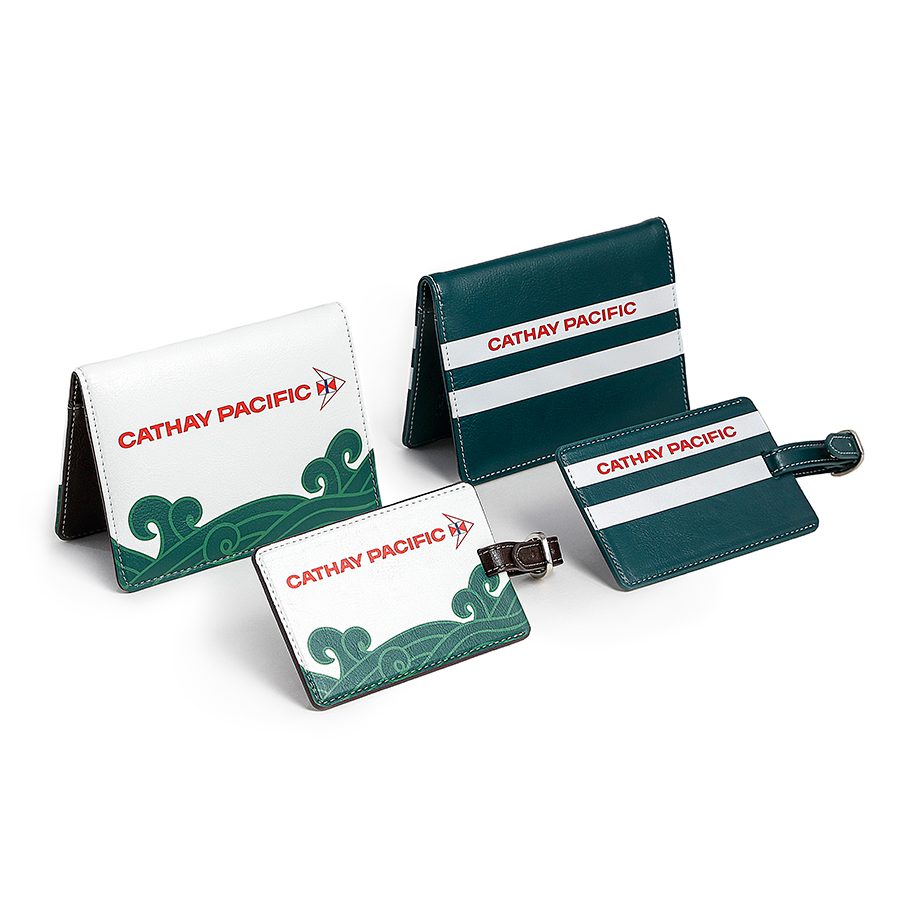 A set of Cathay Classic luggage tag and passport holder travel accessories in cream white and dark green 