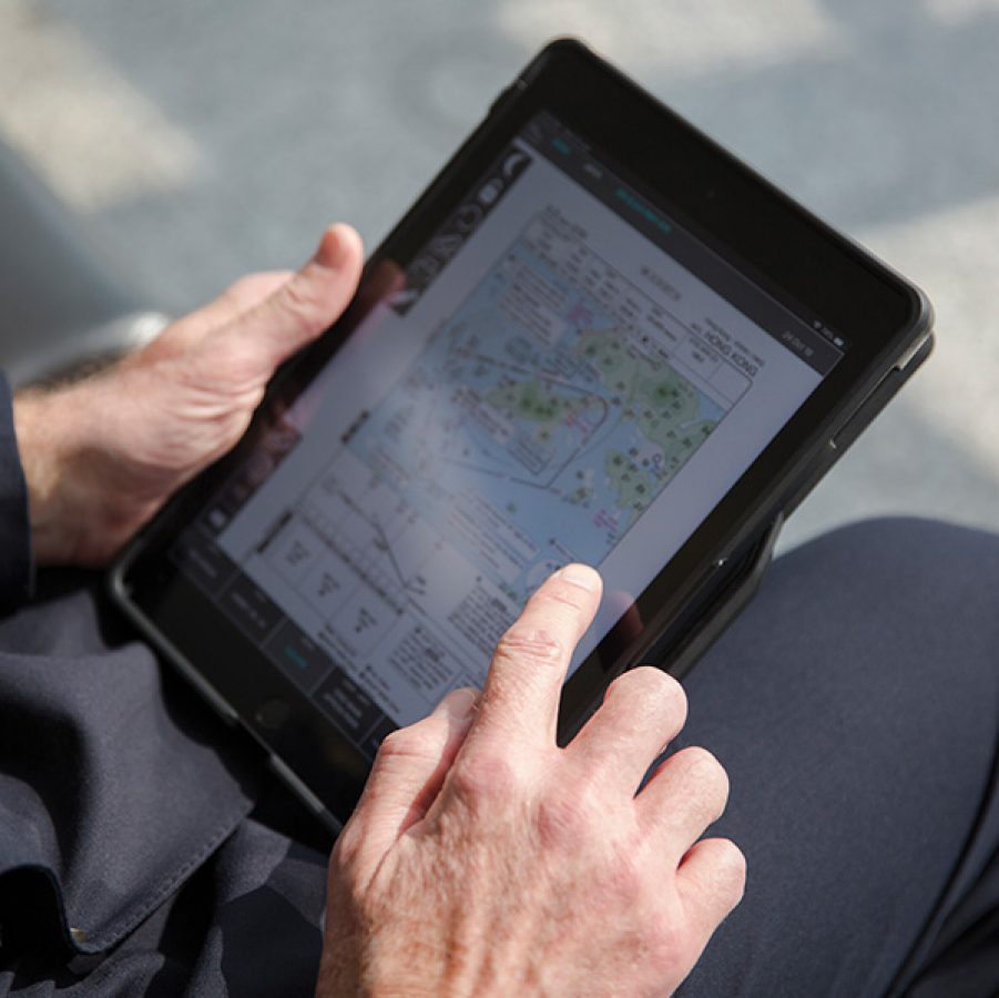 A pilot using a tablet