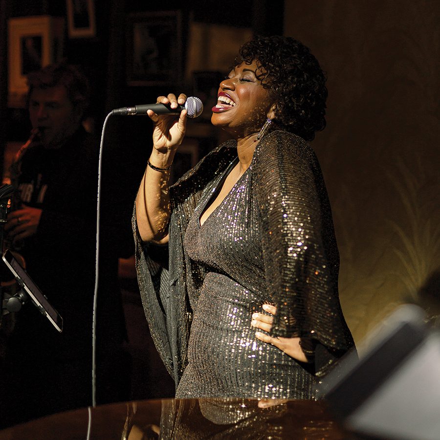 Woman singing in a bar